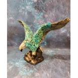 A Duncan Enterprises Company ceramic eagle, perched with wings outstretched, applied with