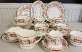 A Royal Worcester Royal Garden pattern tea service,  comprising five cups, saucers, side plates,