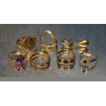 A 9ct gold gypsy ring set with three round garnets, size M 1/2, 1.94g gross; a 9ct gold half