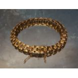 A 15ct gold three row panther link bracelet, 15g
