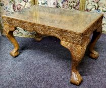 A low Anglo-Indian carved sandalwood coffee table, the rectangular top carved with scrolling
