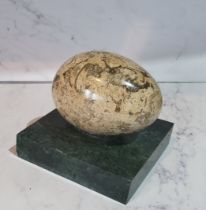 A marble egg shaped desk weight, square base, 8cm wide