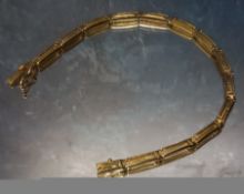 An 18ct gold bracelet, elongated Greek key links, stamped 750, 7.4g