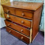 A Victorian mahogany chest of two short above three long drawers, scumbled handles, lacking feet,