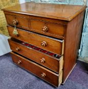 A Victorian mahogany chest of two short above three long drawers, scumbled handles, lacking feet,