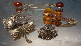 An unusual silver and amber brooch in the form of a violin, stamped 925; a continental silver and