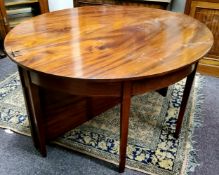 A George III mahogany D-end dining table, one additional leaf c.1780
