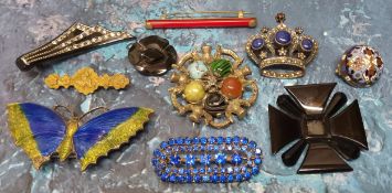 Vintage brooches including a Celtic white metal brooch set with semi precious cabochon stones; a