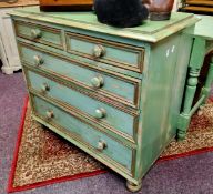 A Victorian green painted pine chest, of two short and three long draduated drawers, turned handles,