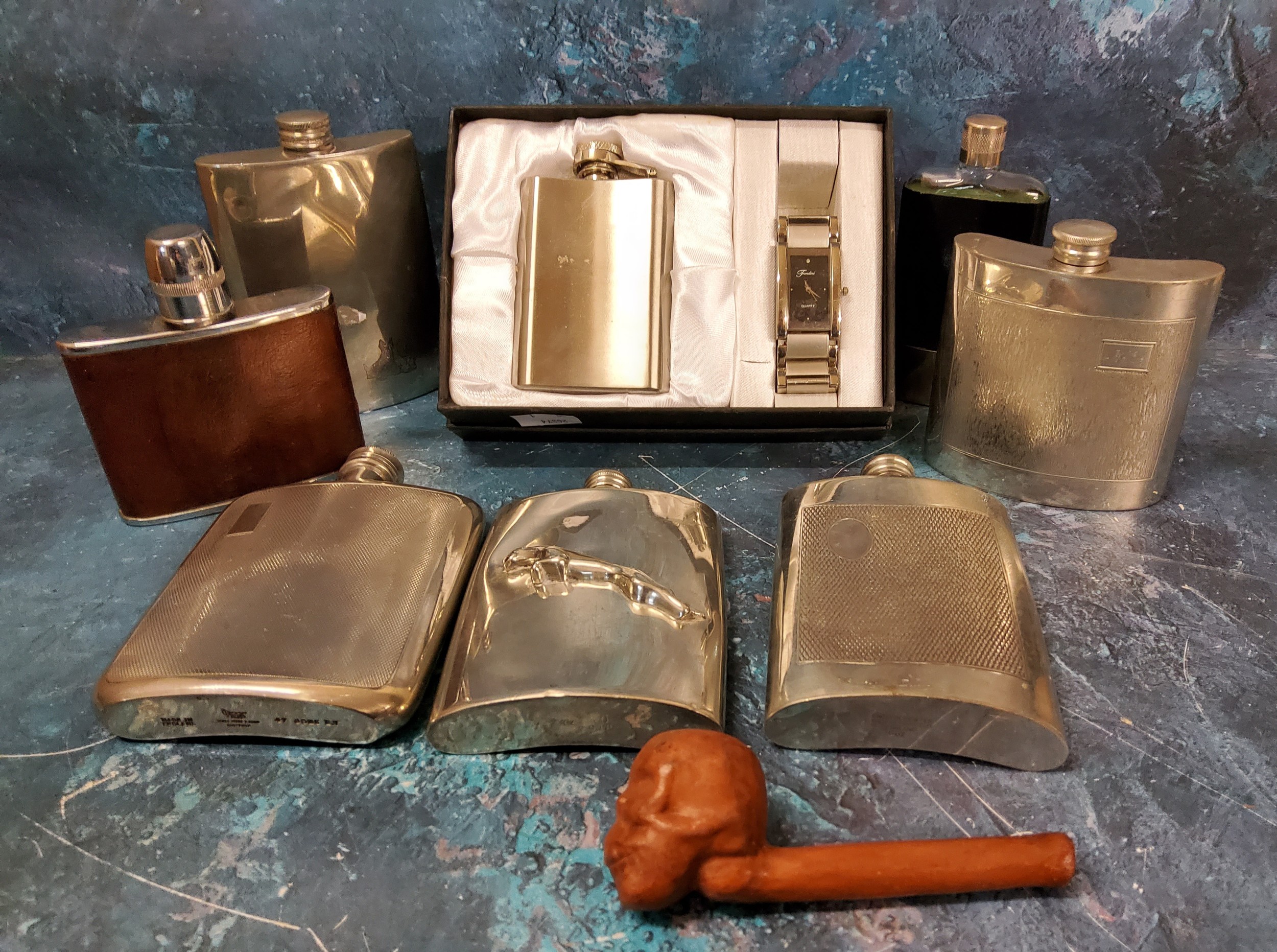 A chrome hip flask, Jaguar emblem;  others