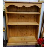 A farmhouse pine open bookcase, holding four adjustable shelves, plinth base, 122cm high x 9cm