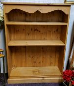 A farmhouse pine open bookcase, holding four adjustable shelves, plinth base, 122cm high x 9cm