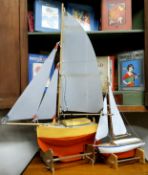 A 'footie' scratch built wooden pond yacht called Neddy, with masts, sails and rigging, with painted
