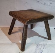 A 19th century elm milking stool, square top, ring turned legs, 18cm high, 20cm wide, c.1890