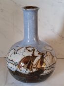 A Royal Doulton bottle vase, tube lined with a continuous scene of galleons at sea, 17cm high,