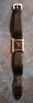 A Roy King silver wristwatch, black rectangular dial, leather strap, London 1978