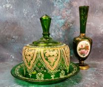 A 19th century Bohemian emerald glass bottle vase, with oval panel painted with flowers, the