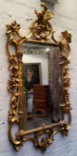 A Florentine style reproduction mirror, gilt resin, 102cm high