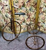 A Victorian style wrought iron child's tricycle, 69cm high x 70cm wide x 47cm deep