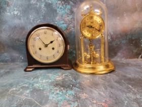 An Art Deco Enfield Bakelite domed mantel clock, Arabic numerals, twin winding holes, c.1930;  an