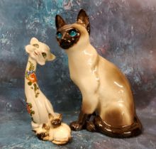 A large Winstantley model, of a Siamese cat, 34cm high, painted mark;  a pair Beswick Siamese