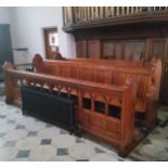 The right hand Victorian pitch pine choir stall from Dore Church, including pierced fretwork hymn