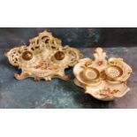 A French Rococo porcelain standish, decorated with colourful flowers, picked out in gilt, 17cm wide,