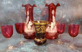 A pair of Victorian Mary Gregory cranberry jugs, enamelled in white with a boy and a girl, holding a