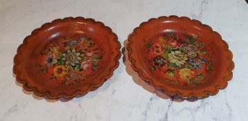 A pair of 19th century shaped circular papier mache wine coasters, painted with flowers, 16.5cm