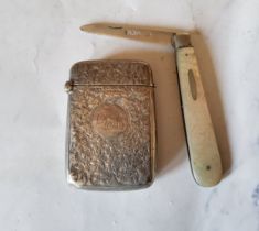 A large early 20th century  silver rectangular vesta case, engraved overall with foliage, 5.5cm