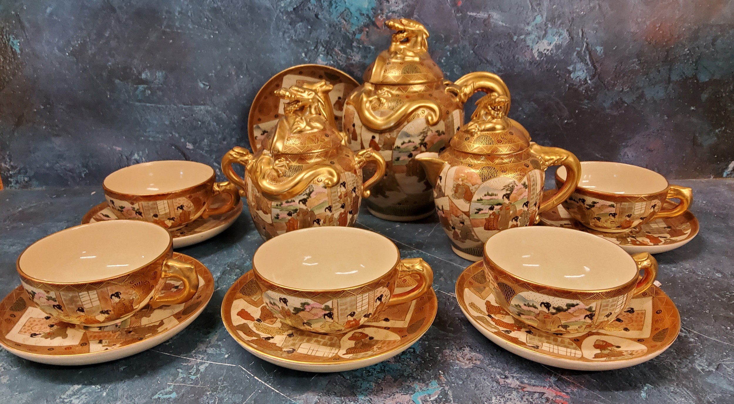 A Japanese satsuma tea service, each typically decorated in with ladies on panels, gilt dragon