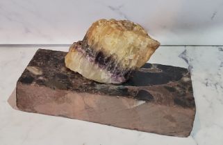 A Derbyshire Blue John specimen, mounted as a desk weight, the base 10cm wide