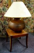 A substantial Middle Eastern copper table lamp; a small 19th century mahogany occasional table (2)