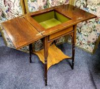 A late Victorian rosewood sewing table, the satinwood strung and hinged surface reveals a club house