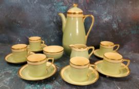 An Art Deco Gray's Pottery 'Sunbuff' coffee set,  for six decorated with green, banded in cream