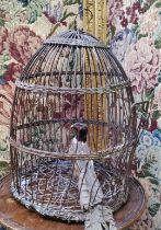 An early woven bronzed wire bird cage,  33cm high