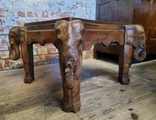 A Square tribal occasional table, elephant carved legs, 44cm high,  67cm wide, 67cm deep