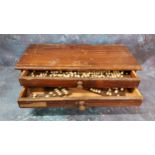 Dentistry Interest - various enamelled and porcelain teeth, in an oak case