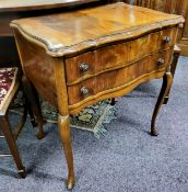 A reproduction serpentine chest of two drawers to frieze, with crossbanded, split veneered surface