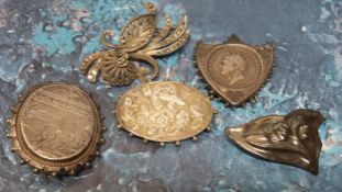 Vintage brooches including an unusual white metal shield shaped brooch/stand, holding a George IV