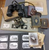 A pair of early 20th century binoculars;  Miranda 10 x 50 binoculars, cased;  photograph albums;
