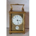 A 19th century brass carriage alarm clock, Arabic numerals, alarm dial, swing handle, 14cm high,