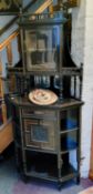 A Victorian  amboyna and ebonised  corner cabinet, gallery cresting, above glazed cabinet and open