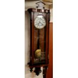 A 19th century walnut Vienna twin weight wall clock, by Gustav Becker, Roman numerals, twin