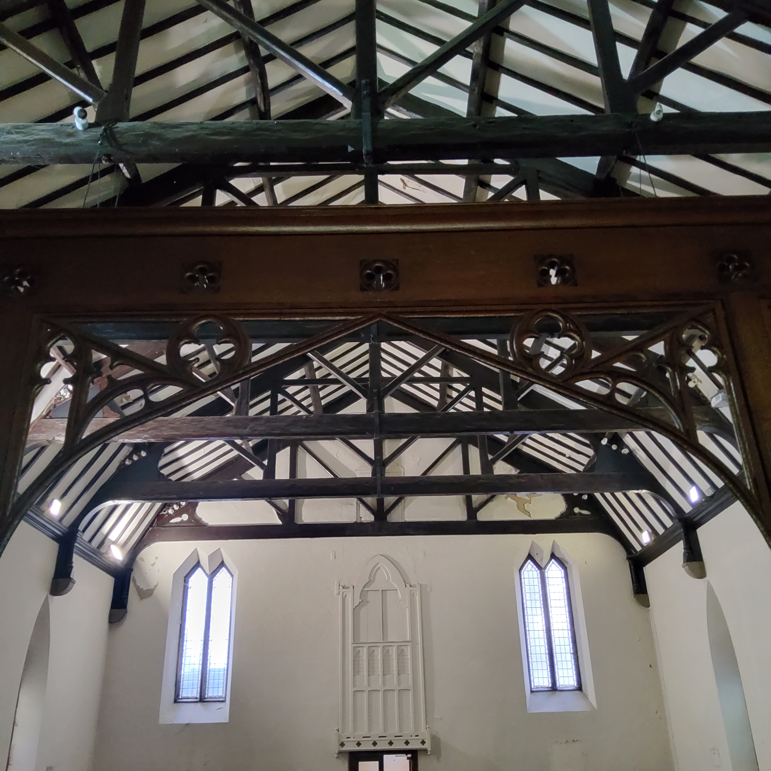 A Victorian carved oak ecclesiastical rood screen with three open archways leading to the chancel - Image 4 of 5