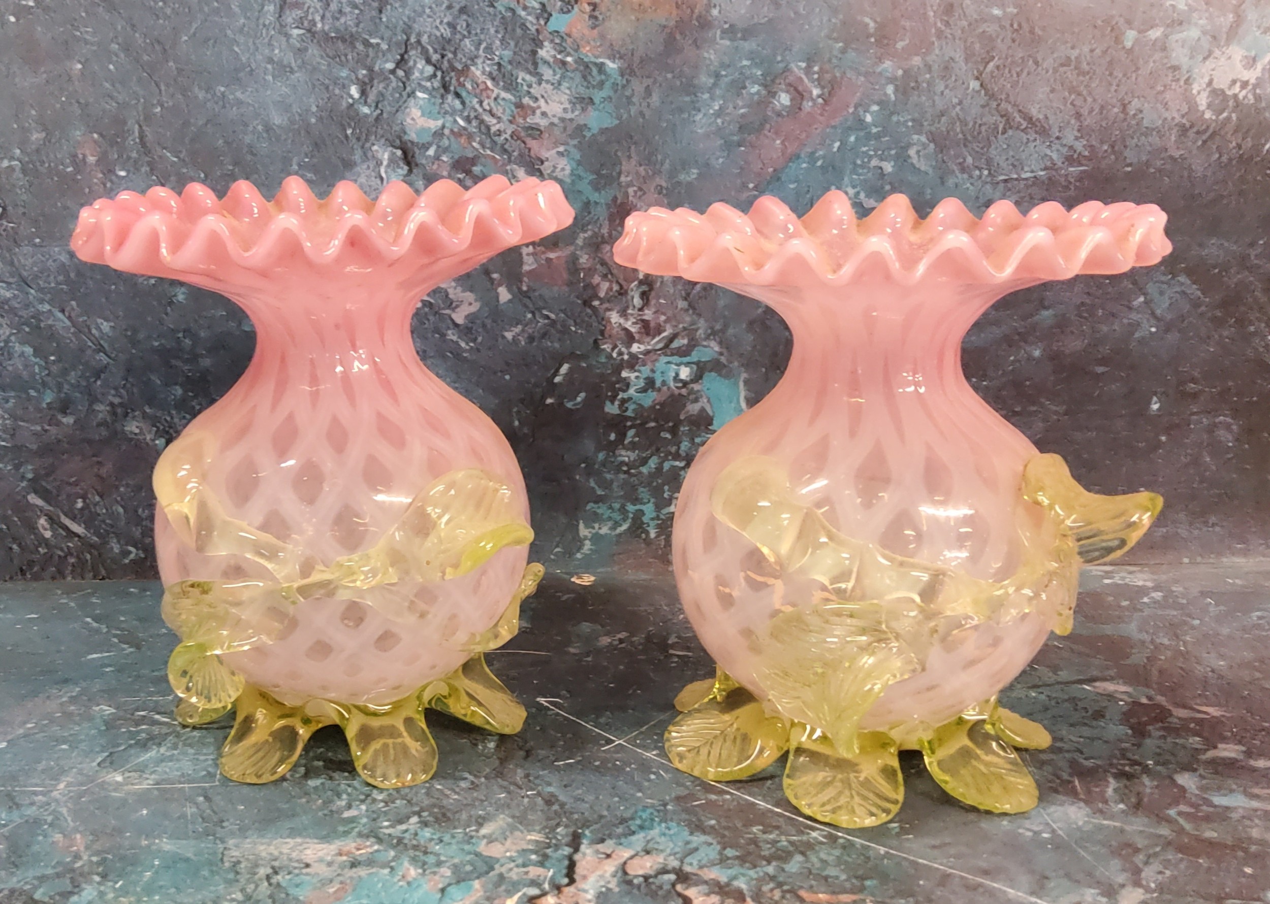 A pair of Victorian satin glass globular vases, with flared frilly rims, applied with vaseline