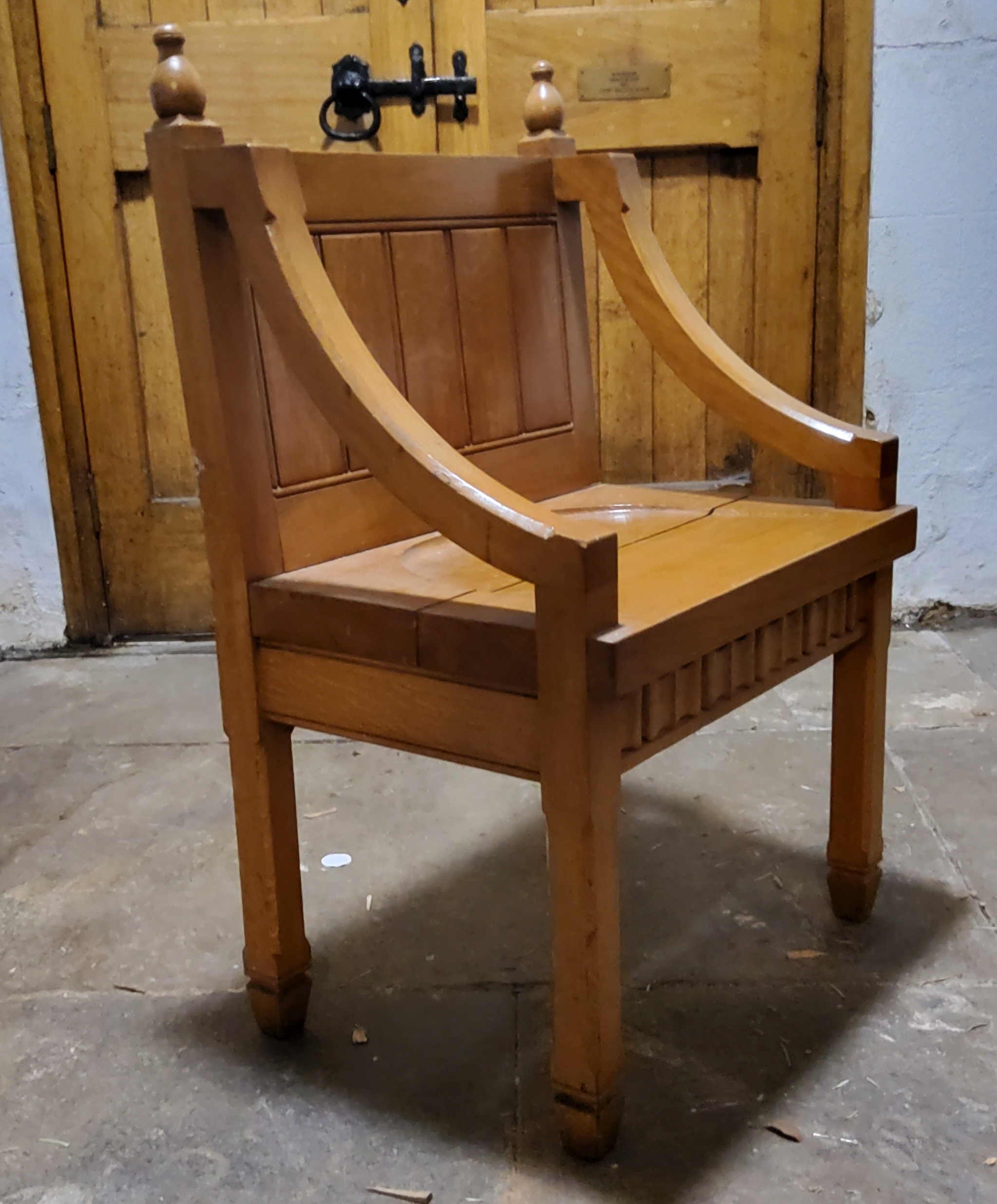 A 20th century golden oak priest's chair; A Victorian Gothic revival circular hall table (2)