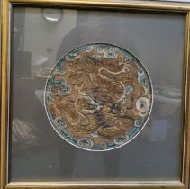 Chinese School, mid 19th century, circular medallion from a Buddhist robe, embroidered in coloured