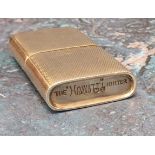A silver petrol lighter, engine turned decoration, stamped,' The Howitt' , Dudley Russell Howitt,
