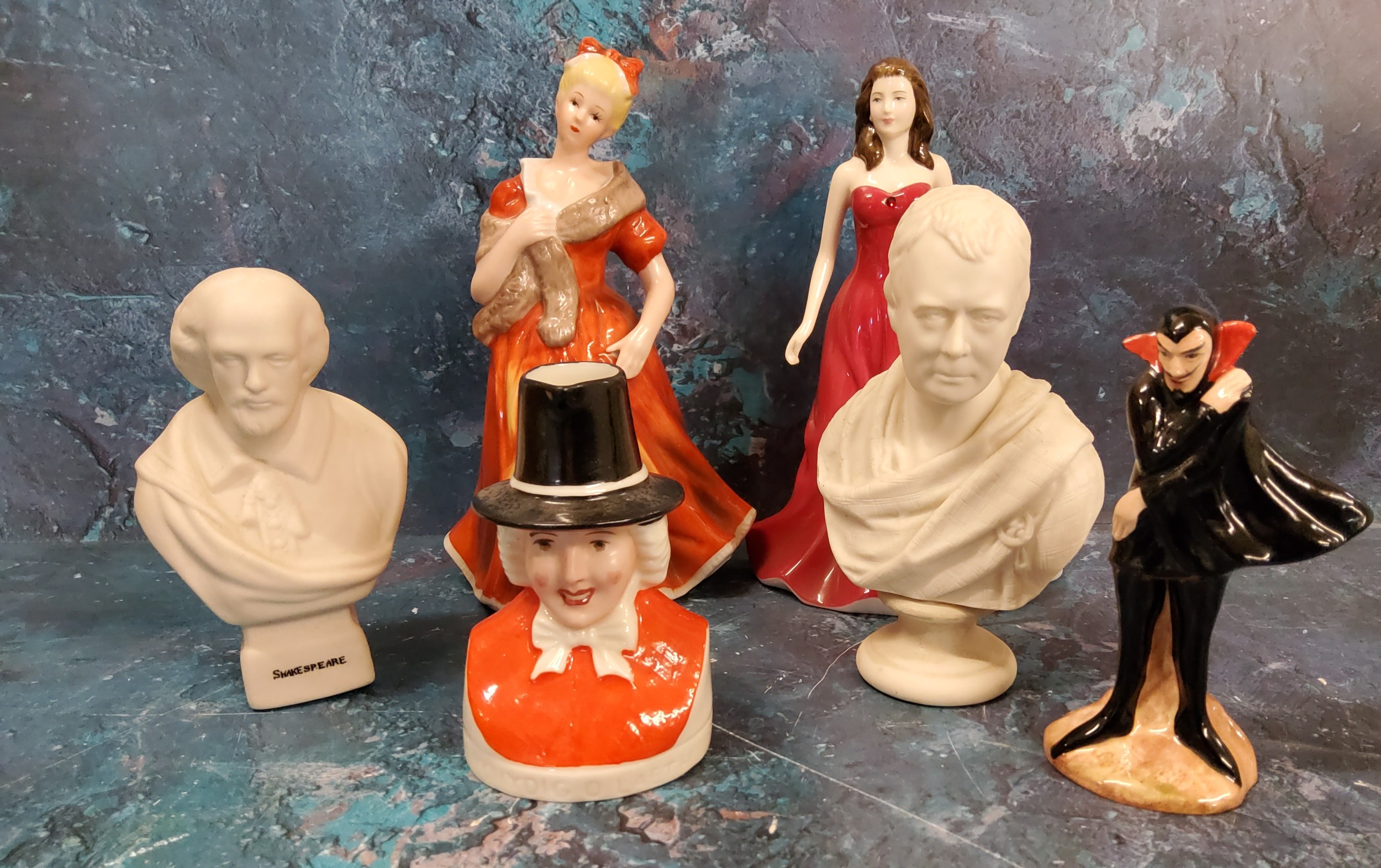 A Carlton Ware Mephisto Series figure, he stands, wearing a black cape, 11cm high, printed mark;